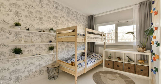 bunk beds in a kids bedroom with wallpaper⁠